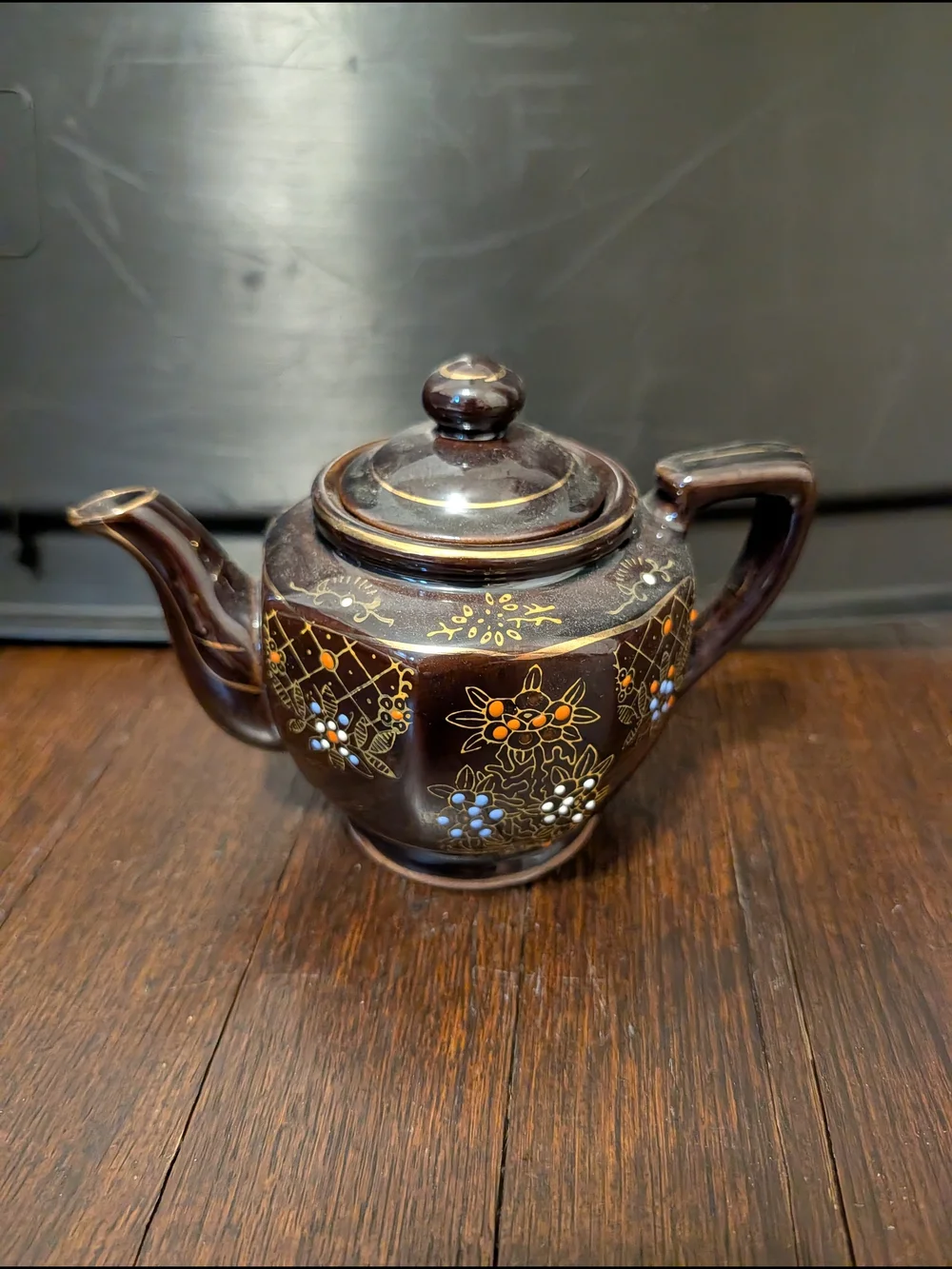 Brown Ceramic Teapot with Hand-Painted Floral Detail